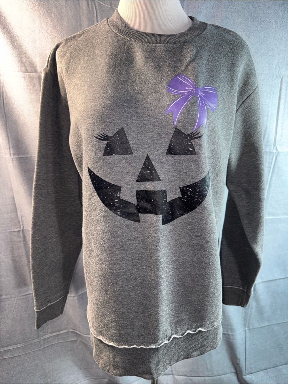 2212-L.A.T Girls' Grey Pumpkin Face Sweatshirt with Purple Bow Accent by